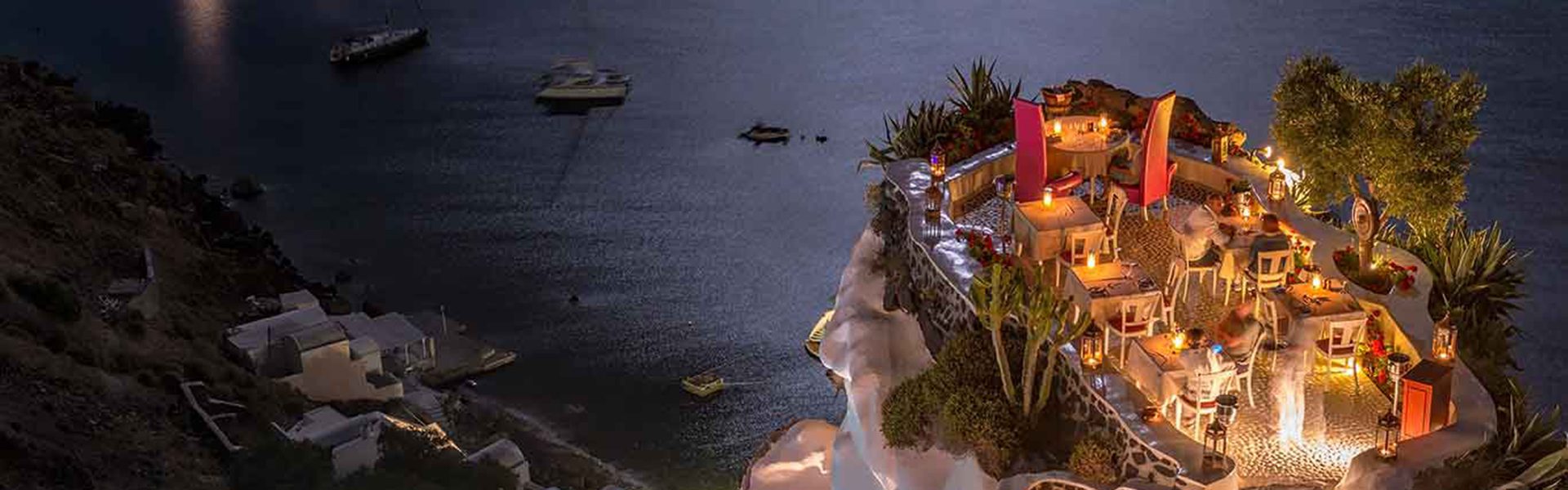 Terrace in front of the ocean. Restaurant with sea view at night